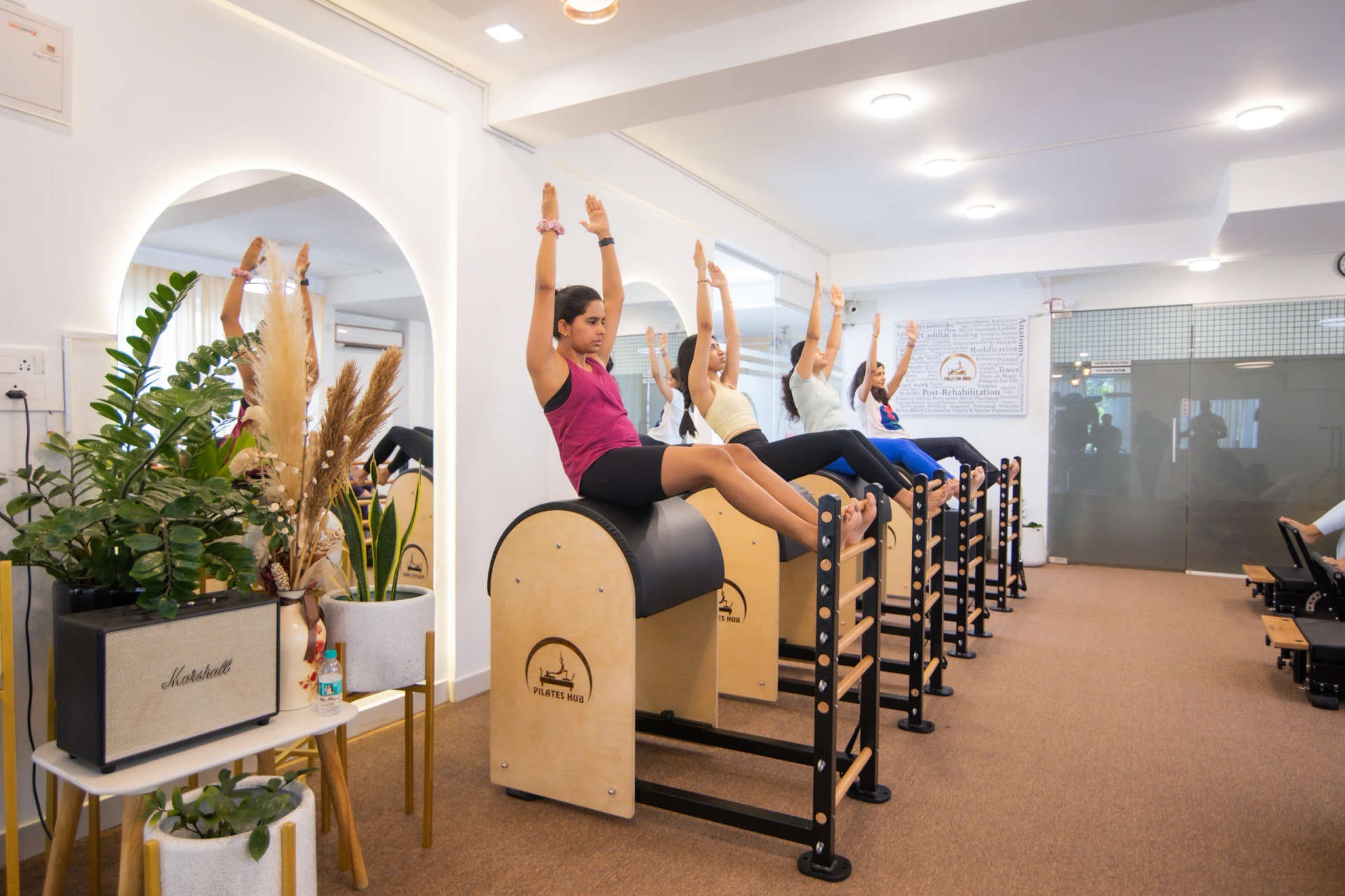 Pilates practitioner, pose 1 of 4